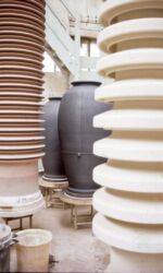 Two large pots among the insulator stacks at Allied Insulators.