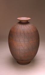 Oval urn with small neck, banded and diagonal scoring. Rust/black.
Height 64cm/25”.