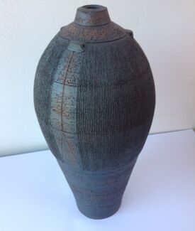 Tall slender urn with small neck. 45cm/18” high.