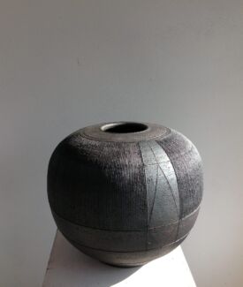 Spherical urn with closely scored parallel lines. 40cm/16” high.